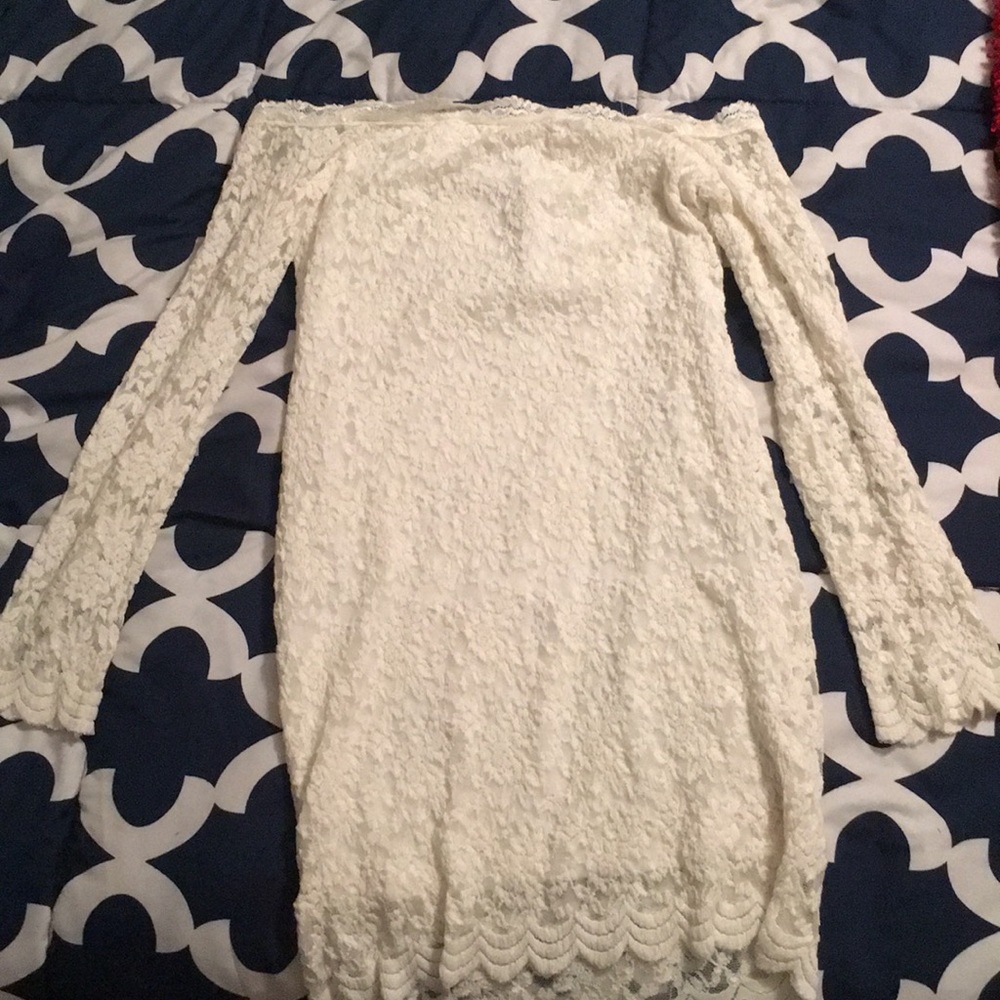 A simple white lace off the shoulder dress